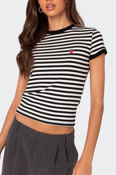 Online only! Make a statement while staying comfy in this Edikted striped t-shirt, featuring an adorable embroidered design. This t-shirt is a must-have addition to your casual wardrobe.


	T-shirt
	Embroidered strawberry detail
	Striped fabric
	Cotton, Spandex
	Model wears size S
	Model height is 5'7
	Item care: Wash with similar color Spring Crew Neck T-shirt With Striped Collar, Trendy Striped Crew Neck Top, Trendy Crew Neck Top With Striped Collar, Trendy Short Sleeve Tops With Vertical Stripes, Cute Striped Cotton T-shirt, Cute Striped Short Sleeve T-shirt, Black Summer Tops With Striped Hem, Black Summer Top With Striped Hem, Spring Crew Neck T-shirt With Contrast Stripes