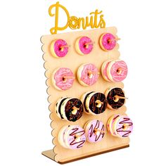 a wooden display with doughnuts and donuts on it