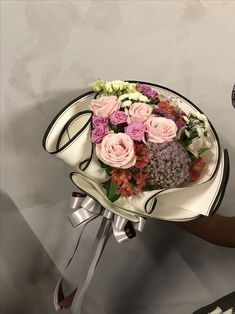 a bouquet of flowers sitting on top of a white plate