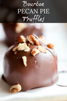 chocolate covered candies with walnuts and pecans on top