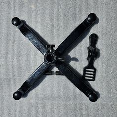 the four blades are attached to each other on the floor with two forks in front of them