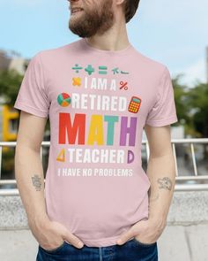 a man wearing a pink shirt that says i am a retired math teacher