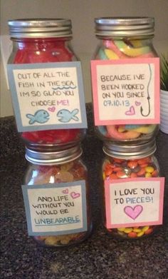 three jars filled with different types of candy