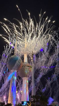 fireworks are lit up in the night sky above disney's magic kingdom at walt world