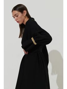 Yaffa or Jaffa in English Black Abaya with Braided Gold Sleeve Details Versatile: Dress up or down for various occasions Gorgeous for Ramadan and Eid gatherings Detachable Belt for Stylish Options Textured Linen Fabric for an elegant Look