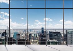 an empty room with large windows overlooking the city stock photo - 957982