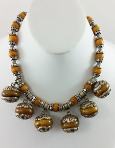 "Vintage, Rare, Delicious and One-of-a-kind! This Vintage Tibetan Repousse Silver Capped Butterscotch Manmade Amber Pendant & Silver Capped Faux Amber Beads Necklace was made by Jacki Marsh and is sure to turn heads and be an immediate conversation starter! The small silver beads and clasp are .925 Sterling Silver. Tibetan men and women wear jewelry all of their lives for adornment, for religious purposes and for the protection that the jewelry brings. Approximate Length (clasped): 7-1/2\" A Letter Charm Bracelet, Amber Bead Necklace, Exotic Jewelry, Chunky Bead Necklaces, Tibetan Jewelry, Silver Caps, Beaded Jewelry Designs, Amber Pendant