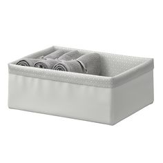 a white storage box with towels in it