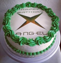 a birthday cake with green frosting and an x on the top that says happy birthday angel