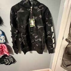 Brand New Never Worn Camouflage Cotton Hooded Jacket For Streetwear, Urban Camouflage Hooded Jacket For Streetwear, Urban Camouflage Sweatshirt For Streetwear, Camouflage Long Sleeve Hoodie For Streetwear, Camouflage Hooded Jacket With Adjustable Hood For Streetwear, Long Sleeve Camouflage Hoodie For Streetwear, Camouflage Hoodie Sweatshirt For Streetwear, Sporty Camouflage Sweatshirt For Streetwear, Camouflage Long Sleeve Sweatshirt For Streetwear