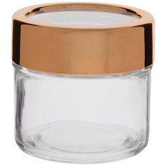 an empty glass jar with a gold lid