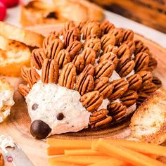 a hedgehog made out of pretzels sitting on top of a cutting board