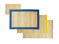 three rugs with blue and yellow trim on them, one in the shape of a rectangle