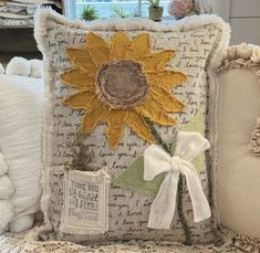 a pillow with a sunflower on it