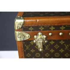 This magnificent Louis Vuitton shoe trunk features stenciled canvas monogram, Louis Vuitton stamped solid brass locks, brass studs and leather side handles. This Vuitton trunk also has got a magnificent honey color lozine trim.  Its hand painted customized stripes on its sides add a very personal touch to this Vuitton trunk. It has got a beautiful and warm patina and is really gorgeous.  Its interior has been partly relined in its original chocolate brown color felt and its removable tray have b Lv Steamer Trunk, Chocolate Brown Color, Honey Color, Chocolate Brown Colour, Honey Colour, Louis Vuitton Shoes, Dark Academia, Chocolate Brown, Personal Touch