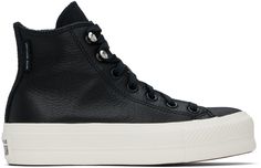 High-top water-repellent leather sneakers in black. · Rubber cap toe · Lace-up closure · Logo embossed at inner side · Cushioned OrthoLite® footbed · Fleece lining · Rubberized logo patch at heel · Platform rubber midsole · Treaded rubber outsole · Platform: H1.5 Supplier color: Black/Black/Egret Converse Leather High-top Sneakers For Sports, Leather High-top Converse Sneakers, Converse Leather High-top Sneakers With Rubber Heel Cap, Converse Leather High-top Sneakers With Studded Outsoles, Black Leather Converse High-top Sneakers, Black Chuck Taylors, Black Chucks, Chuck Taylor All Star Lift, Converse Black