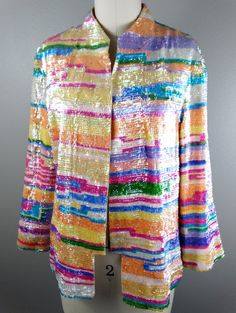 "This is a RARE and GORGEOUS vintage piece! It's fully embellished with colorful iridescent pastel sequins and accented with an embroidered bird on the back. It's in absolutely perfect condition! Bust - 40\" (with the one closure intact) Shoulders - 17\" hem to hem Sleeves - 20\" Length - 24\" Tag Size - US 10 All of my items come from a smoke-free and pet-free home. If you have any questions, please don't hesitate to ask!" Spring Multicolor Sequin Fabric, Iridescent Sequin Fabric For Spring, Glamorous Multicolor Sequin Fabric For Spring, Spring Embellished Multicolor Sequin Fabric, Embellished Multicolor Outerwear For Spring, Multicolor Embellished Outerwear For Spring, Iridescent Sequin, Checkered Jacket, Sequin Cardigan