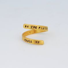 Quote Wrap Ring - "Oh The Places You'll Go" by Dr. Seuss. Hand forged and hand stamped by maker, Christine Street. lightweight, very comfortable, sterling silver and also available in 14kt gold vermeil. Fits sizes 4-9. Adjustable. Perfect for a graduation gift or birthday. Everyday Gold Hand Stamped Engraved Ring, Gold Wrap Ring, Graduation Rings, Gold Wrap, Wrap Ring, Wrap Rings, Oh The Places Youll Go, Dr Seuss, Hand Forged