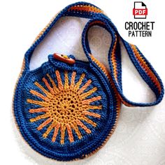 a crocheted bag with an orange and blue design on it's side