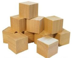 several wooden blocks stacked on top of each other in the shape of cubes with one block missing