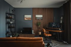 a living room filled with furniture and a flat screen tv