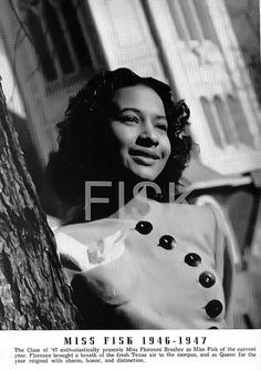 a black and white photo of a woman leaning against a tree with buttons on it