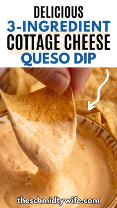 a tortilla chip being dipped with quesadilla sauce in a bowl