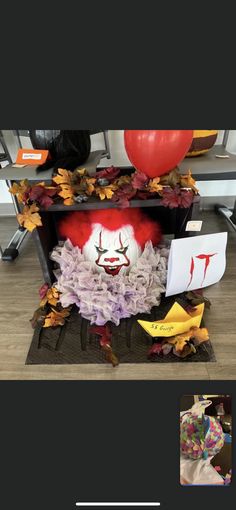 an image of a clown made out of bananas and other things on the table with balloons