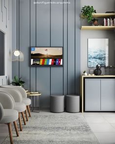 a living room with grey walls and white furniture in front of a flat screen tv