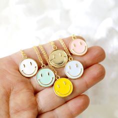 "Beautiful and lovely happy face charm necklace. Made of blush rose color enamel smiley face charm with skinny gold plated brass chain. Soft and warm. Great for a gift, every day or special occasion. Your item will ship in a gift box. Please feel free to contact me if you have any questions. ♥ Length 14\" -20\" chain ♥ Charm 5/8\" x 3/4\" ♥ Gold plated over brass / Blush rose color enamel ♥ Delivery Time Fast shipping within 1 - 3 days ♥ See more Rudiana Accessories Rudiana.etsy.com" Fun Jewelry With Adjustable Chain For Gifts, Pink Smiley Face Jewelry For Everyday, Playful Gold Jewelry With Smiley Face, Playful Gold Smiley Face Jewelry, Playful Smiley Face Jewelry For Gifts, Cheerful Smiley Face Jewelry For Everyday, Personalized Fun Gold Necklaces, Playful Gold Charm Necklace As Gift, Cheerful Smiley Face Jewelry As Gift