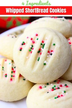 some cookies with sprinkles on a white plate