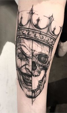 a skull with a crown on it's head is shown in this tattoo design