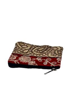 Elevate your accessory collection with this exquisite coin pouch, showcasing the intricate art of Zari embroidery. This handmade pouch features a striking combination of multiple colors and gold threads, meticulously woven into floral and paisley patterns. Perfect for the modern bohemian chic, this Banjara small pouch offers both style and functionality. Ideal for carrying coins and small essentials, it adds a touch of traditional elegance to your everyday look. Keywords: bohemian chic accessori Gold Bohemian Embroidered Clutch, Gold Bohemian Clutch For Festive Occasions, Bohemian Handmade Gold Clutch, Bohemian Gold Festive Pouch, Handmade Bohemian Gold Clutch, Bohemian Gold Rectangular Potli Bag, Festive Gold Bohemian Pouch, Festive Bohemian Gold Pouch, Festive Gold Clutch With Floral Embroidery