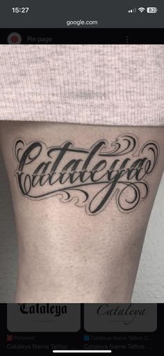 a woman's thigh with the word tattoo on it and her name tattooed in cursive writing