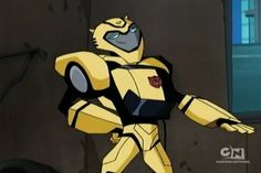 the animated character is dressed in yellow and black with his arms out to the side