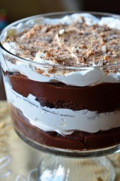 a layered dessert in a glass dish on a table