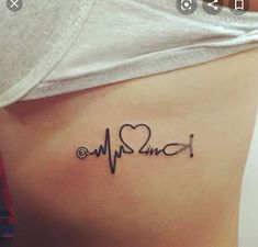 a woman with a heartbeat tattoo on her stomach and the word i love you written in cursive writing