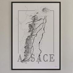 a black and white poster hanging on the wall