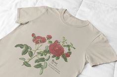 -- Red Rose Definition T Shirt -- A beautiful red rose design printed on a comfortable, soft, and high-quality t-shirt. Whether it's Valentines Day or not, this would make a great gift for her anytime of the year! A one of a kind and original design! Perfect for outdoors, hiking, camping, etc.  -- Creating my designs -- Hey there shoppers! Just a little back story on my products... I've always loved designing anything and everything whether that be paintings, cakes, rooms, decor or clothing prints! I guess you can say this is just another creative outlet for me! All my designs are created by me, using canva, a graphic design program that gives me the creative freedom to come up with all sorts of new prints. I also work with Printify, which is a company that prints my designs onto different Casual Rose Cotton Top, Casual Rose Tops With Rose Design, Casual Rose Print Tops In Rose Color, Casual Rose Print Tops, Casual Cotton T-shirt With Rose Print, Rose Color Crew Neck Top With Rose Print, Red Rose Print Cotton Tops, Red Cotton Tops With Rose Print, Rose Definition