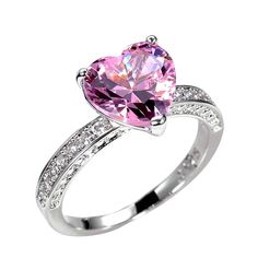 a pink heart shaped ring with diamond accents