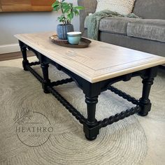 a coffee table sitting on top of a rug in a living room