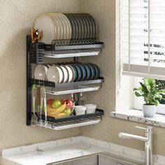 the dish rack is organized with plates and bowls