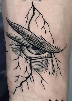 a black and white photo of a tattoo on the arm