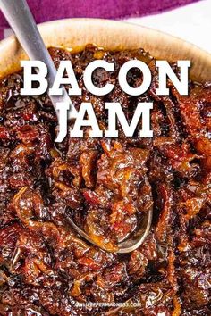 bacon jam in a wooden bowl with a spoon on top and the words bacon jam above it