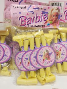 there are many pieces of cake that look like barbie's birthday candles in the package