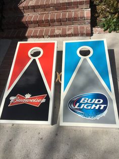 two beer themed cornhole game boards sitting on the sidewalk