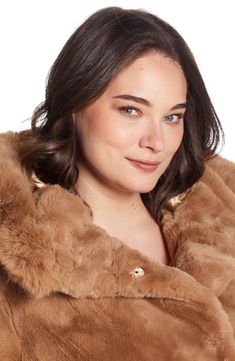 Add a luxe touch to a chilly day in this plush faux-fur coat fashioned with a roomy hood and designed to resist snow and rain. 32 1/2" length Hidden-snap closure Fixed hood Side-seam pockets Water-resistant Lined 100% polyester faux fur Dry clean Imported Luxury Faux Fur Coat For Cold Weather, Cream Faux Fur Coat, White Faux Fur Coat, White Fur Coat, Faux Fur Hooded Jacket, Snow And Rain, Fur Coat Fashion, Cream Coat, Faux Fur Hooded Coat