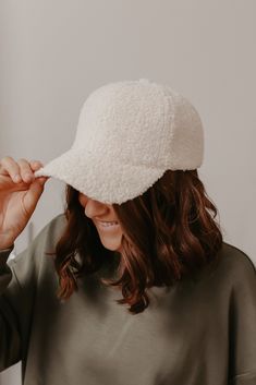 Our Solid Cream Sherpa Baseball Cap is the perfect finishing touch to any casual look! With a velcro back, you can easily do a ponytail or a simple bun. If you're on the go, just style it with your favorite lounge wear for an everyday chic outfit. Soft Sherpa material Velcro back Machine wash Color: Cream Colors may vary on different viewing devices Size and Fit One size fits most Casual Super Soft Hats, Cozy Everyday Hat, One Size Fits Most, Soft Comfortable Hats, One Size Fits Most, Trendy White Winter Baseball Cap, Cozy Everyday Cap Hat, Casual Super Soft Cap, Cozy Everyday Cap, Casual Soft Cap, Cozy Adjustable Super Soft Hats