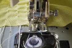 the sewing machine is stitching through the fabric to make it easier for someone to sew