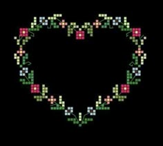 a heart made up of squares and flowers on a black background with the words love written in it